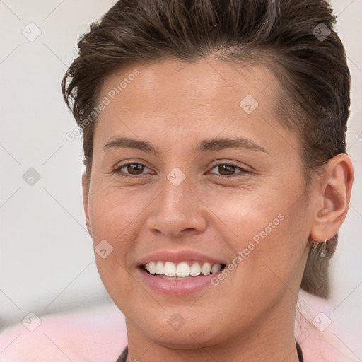 Joyful white young-adult female with short  brown hair and brown eyes