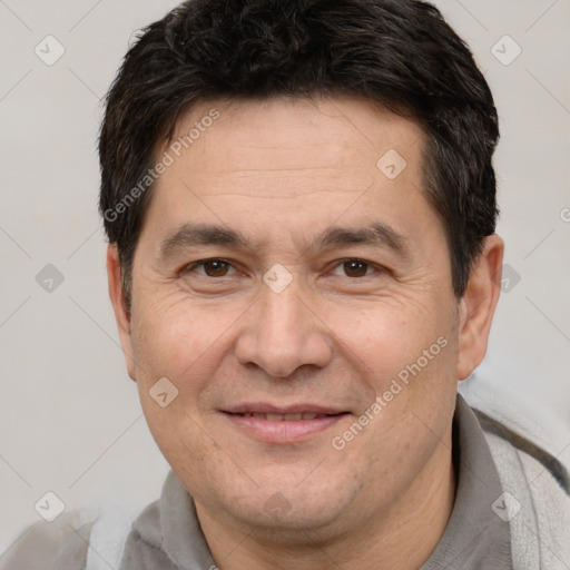 Joyful white adult male with short  brown hair and brown eyes