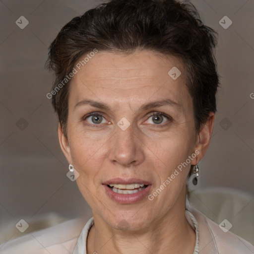 Joyful white adult female with short  brown hair and brown eyes