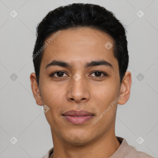 Joyful latino young-adult male with short  black hair and brown eyes