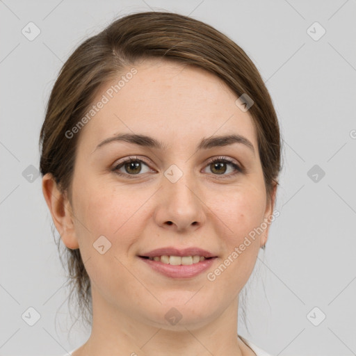 Joyful white young-adult female with medium  brown hair and green eyes