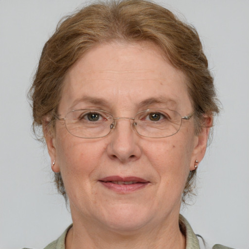 Joyful white middle-aged female with short  brown hair and grey eyes