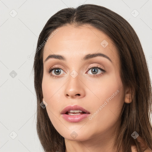 Neutral white young-adult female with long  brown hair and brown eyes