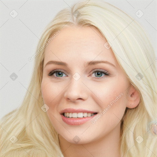 Joyful white young-adult female with long  brown hair and blue eyes