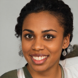 Joyful latino young-adult female with medium  black hair and brown eyes