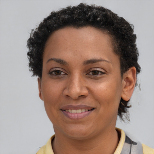 Joyful latino young-adult female with short  brown hair and brown eyes