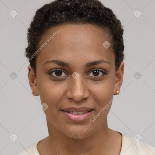 Joyful black young-adult female with short  brown hair and brown eyes