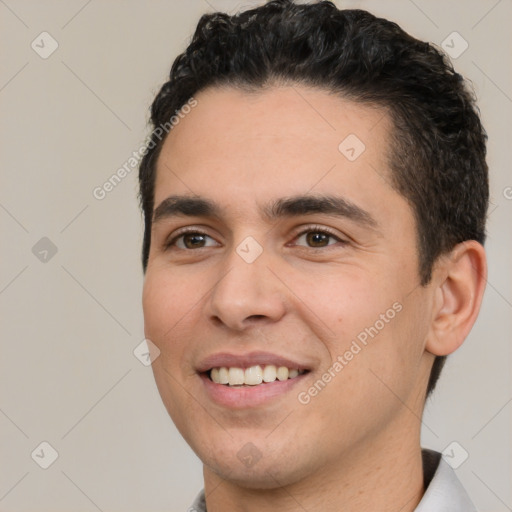 Joyful white young-adult male with short  black hair and brown eyes