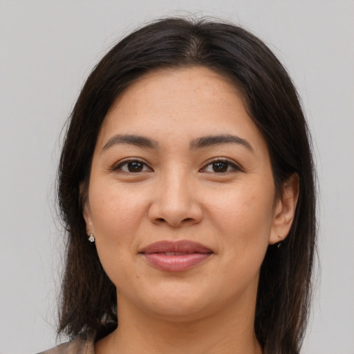 Joyful asian young-adult female with medium  brown hair and brown eyes