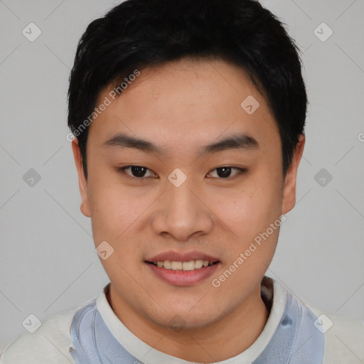 Joyful asian young-adult male with short  black hair and brown eyes