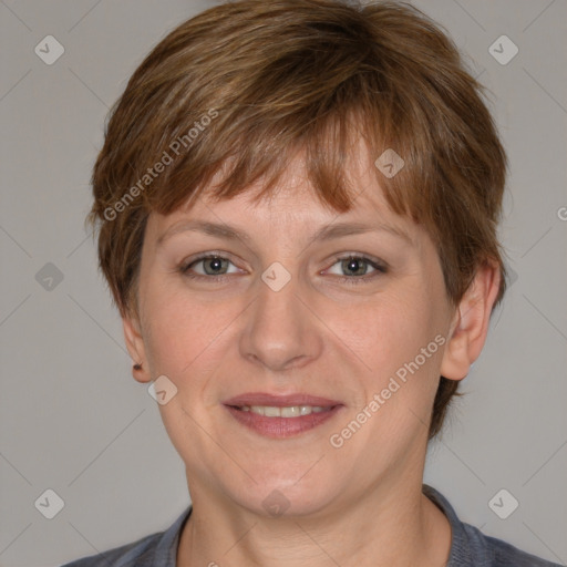 Joyful white adult female with medium  brown hair and grey eyes