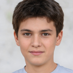 Joyful white child male with short  brown hair and brown eyes