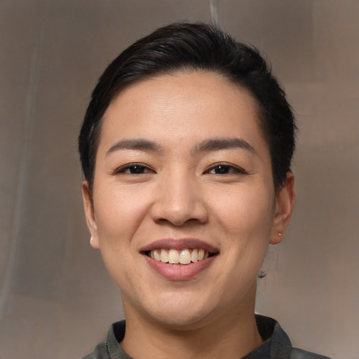 Joyful white young-adult female with short  black hair and brown eyes