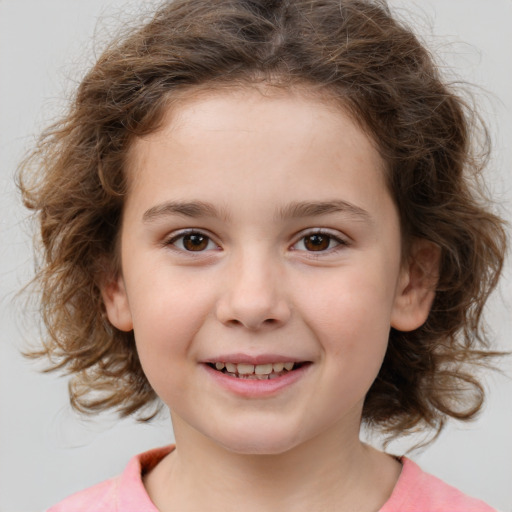 Joyful white child female with medium  brown hair and brown eyes