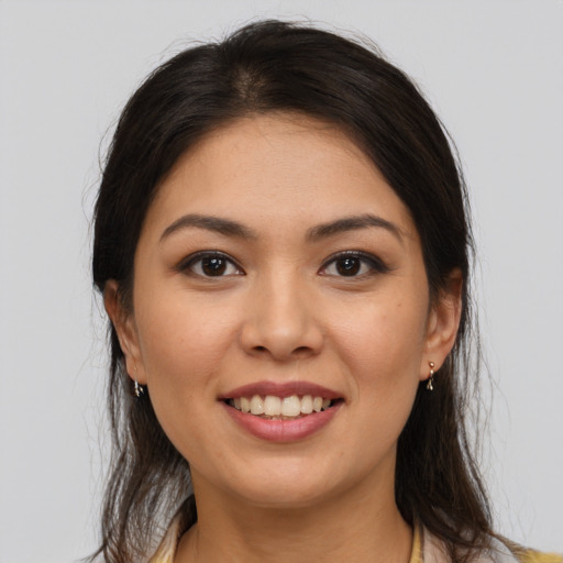 Joyful white young-adult female with medium  brown hair and brown eyes