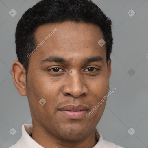 Joyful latino young-adult male with short  brown hair and brown eyes