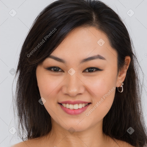 Joyful asian young-adult female with long  brown hair and brown eyes