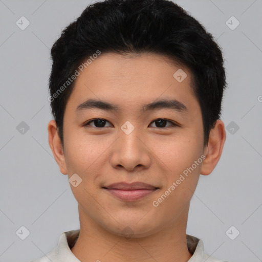 Joyful asian young-adult male with short  black hair and brown eyes