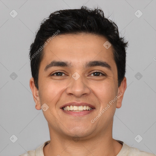 Joyful white young-adult male with short  black hair and brown eyes