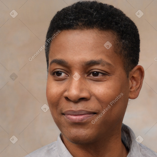 Joyful black young-adult male with short  black hair and brown eyes