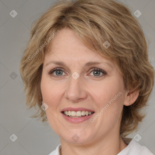 Joyful white adult female with medium  brown hair and blue eyes