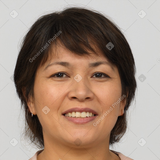 Joyful white adult female with medium  brown hair and brown eyes