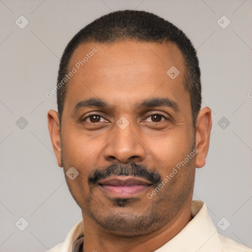 Joyful latino adult male with short  black hair and brown eyes