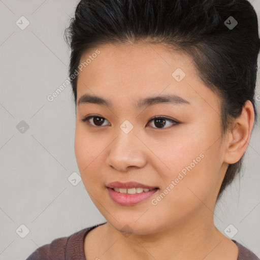 Joyful asian young-adult female with short  brown hair and brown eyes