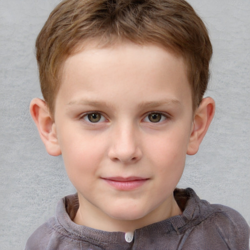 Joyful white child male with short  brown hair and grey eyes