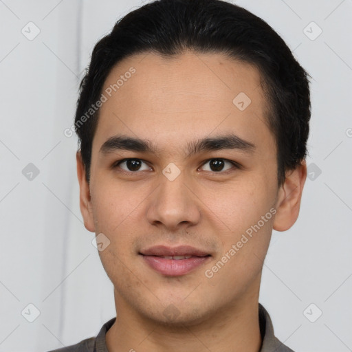 Joyful latino young-adult male with short  brown hair and brown eyes