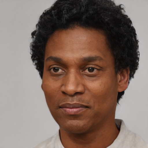 Neutral black adult male with short  black hair and brown eyes