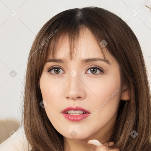 Neutral white young-adult female with long  brown hair and brown eyes