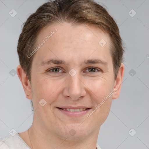 Joyful white adult male with short  brown hair and grey eyes