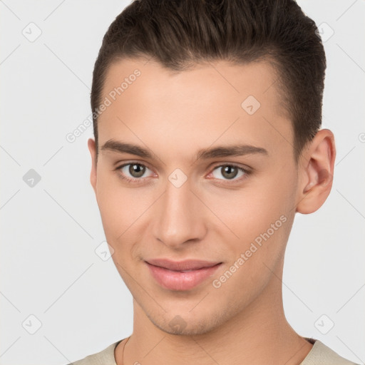 Joyful white young-adult male with short  brown hair and brown eyes