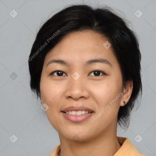 Joyful asian young-adult female with medium  black hair and brown eyes