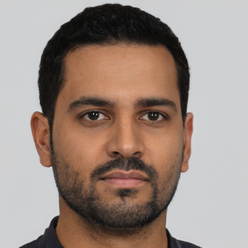 Neutral latino young-adult male with short  black hair and brown eyes