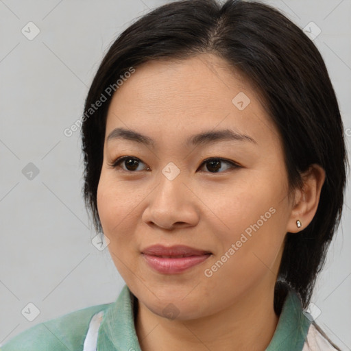 Joyful asian young-adult female with medium  brown hair and brown eyes