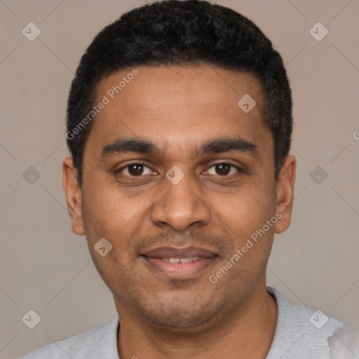 Joyful black young-adult male with short  black hair and brown eyes