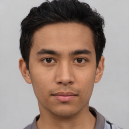 Neutral asian young-adult male with short  brown hair and brown eyes