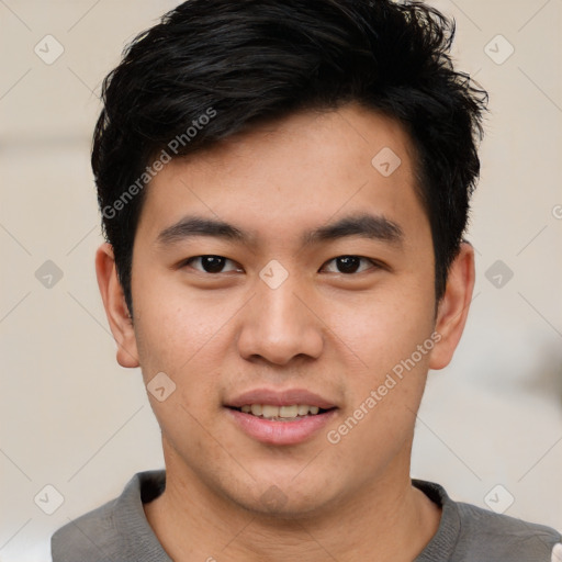 Joyful asian young-adult male with short  black hair and brown eyes