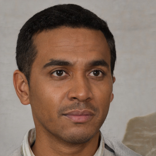Neutral latino young-adult male with short  black hair and brown eyes