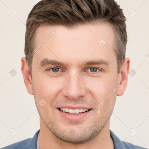 Joyful white young-adult male with short  brown hair and grey eyes