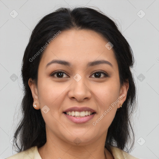 Joyful latino young-adult female with medium  brown hair and brown eyes