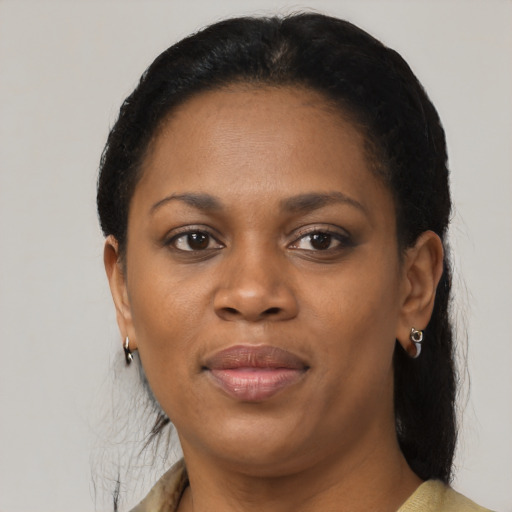 Joyful black young-adult female with medium  black hair and brown eyes