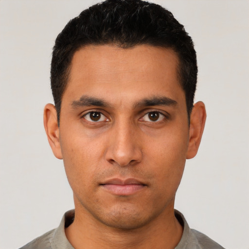 Neutral latino young-adult male with short  black hair and brown eyes