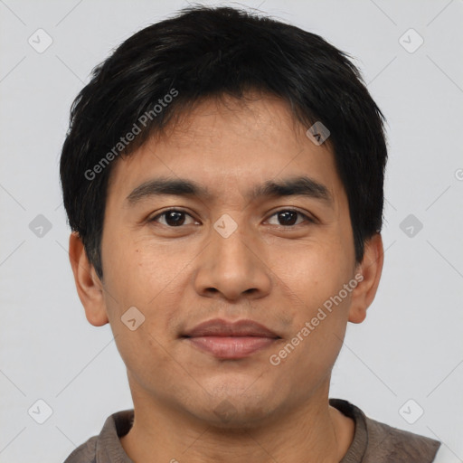 Joyful asian young-adult male with short  black hair and brown eyes