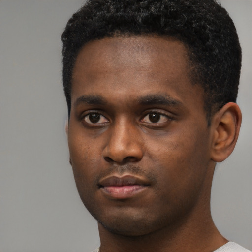 Neutral black young-adult male with short  black hair and brown eyes