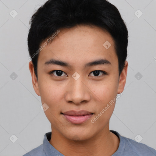 Joyful asian young-adult male with short  black hair and brown eyes