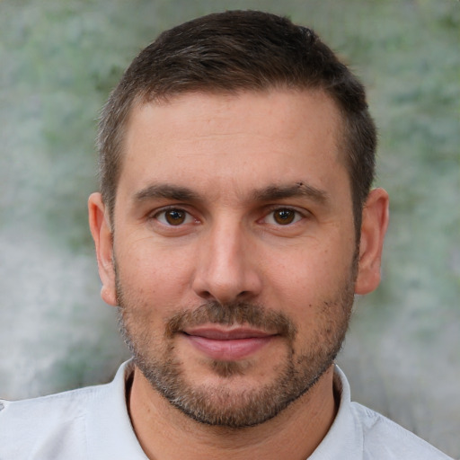 Joyful white adult male with short  brown hair and brown eyes