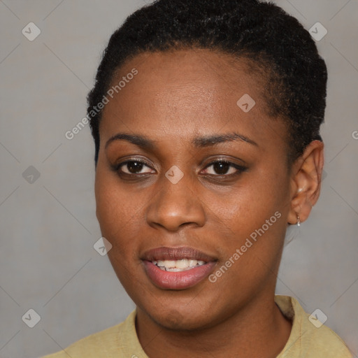 Joyful black young-adult female with short  brown hair and brown eyes